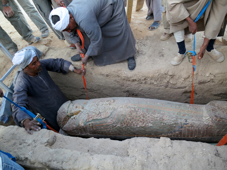 This photo released on Thursday, Feb. 13, 2014 by Egypt's Supreme Council of Antiquities, shows Egyptian men digging up a preserved wooden sarcophagus that dates back to 1600 BC, when the Pharaonic 17th Dynasty reigned, in the ancient city of Luxor, Egypt. (Photo: Egypt's Supreme Council Of Antiquities)